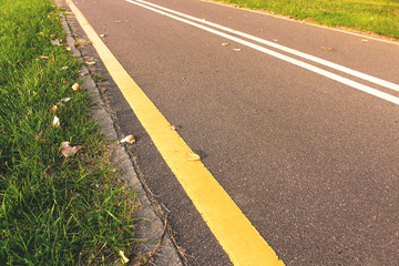 City Bike path with green grass on a sunny day