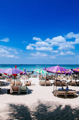Fototapeta na wymiar Phuket vibrant Patong beach with colourful umbrellas
