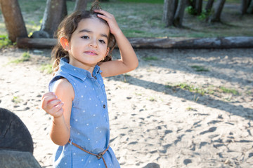 beautiful young girl with hand in long hairs