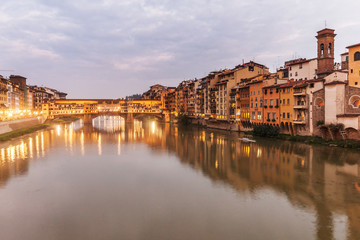 Fototapeta premium Panorama of Ponte Vecchio, famous bridge in Florence, Italy, shot taken at dusk, after sunset