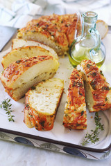 Homemade sourdough white bread grated cheese, olive oil and parsley