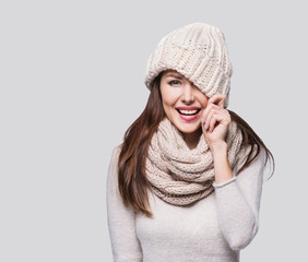 Beautiful woman winter portrait. Smiling girl wearing warm clothes having fun