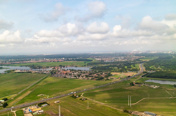 Fototapeta na wymiar An aerial view of the fields and flatlands near Amsterdam in the Netherlands
