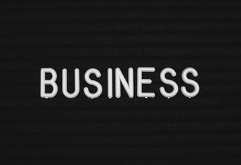Word business written on the letter board. White letters on the black background