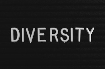 Word diversity written on the letter board. White letters on the black background