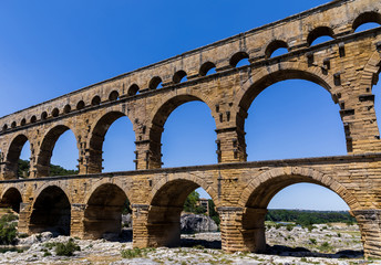 Pont du Gard (bridge across Gard) ancient Roman aqueduct across Gardon River at sunny day in ...