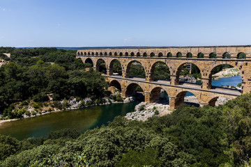 Fototapeta premium aerial view of Pont du Gard (bridge across Gard) ancient Roman aqueduct across Gardon River in Provence, France