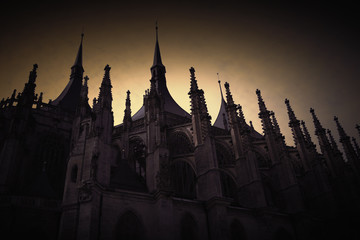 View of a part of the Gothic temple of St. Barbara. Kutná Hora, Czech Republic. Retro stylization with vignetting.