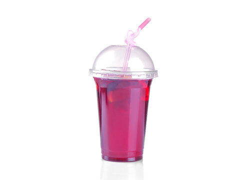 cold karkade tea in a disposable glass with a straw on a white isolated background