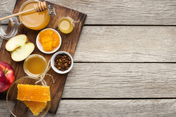 Sweet honey and cut red apple, rustic treat