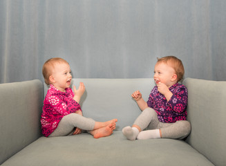 Twin Girls in a Chair