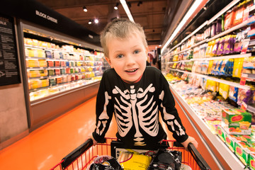 Boy in skeleton costume in grocery store