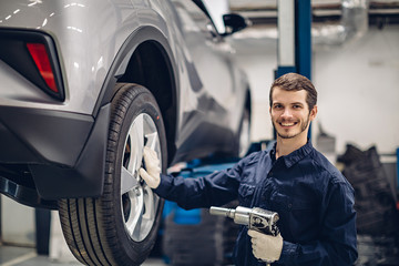 Auto car repair service center. Mechanic at work
