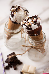 Two cornetto ice cream. Vanilla ice cream on wafle on white background