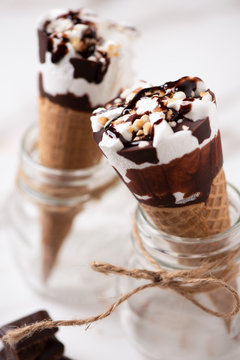 Two cornetto ice cream. Vanilla ice cream on wafle on white background