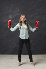 Woman in red boxing glove punch to the goal