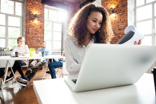 Portrait Of Cheerful Business African-American Lady Working On Laptop.