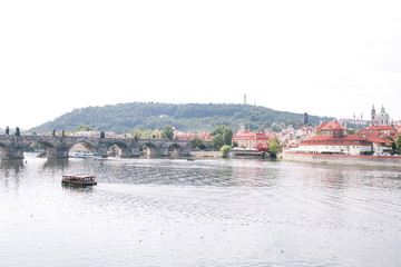 Obraz premium Scene in the photo of the river Vltava, Prague, Czech Republic, Charles Bridge and the old historical architecture. Beautiful landscape of Prague