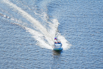 Boat of the rescue service moves on the water
