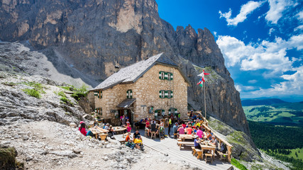 RIFUGIO VICENZA, SASSOLUNGO MASSIF, ITALY, JULY 1, 2018: Mountaineering people resting at Vicenza...