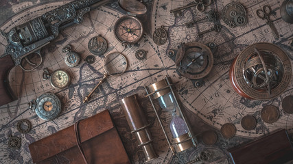 Vintage Compass, Hourglass And Telescope On World Map