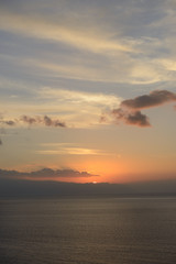 Fototapeta na wymiar Sunset in the clouds over Gomera Island, Tenerife, Canary, Spain.