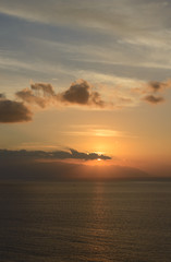 Sunset in the clouds over Gomera Island, Tenerife, Canary, Spain.