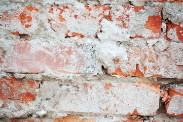Texture of peeled brick, old brickwork on a red wall, loft!