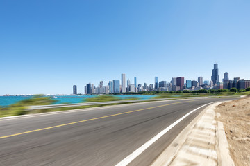 Obraz premium empty asphalt highway through modern city