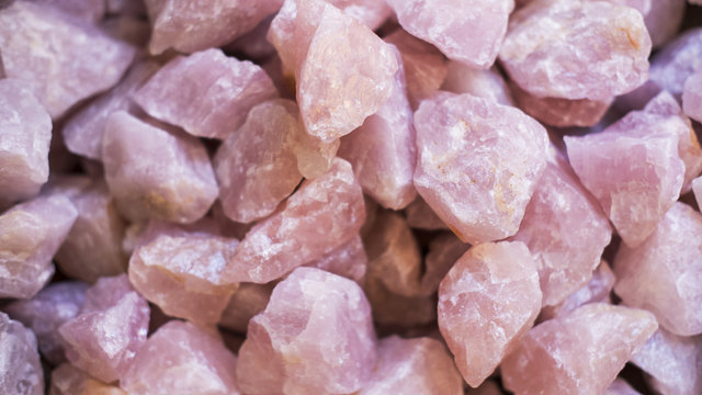 Rose quartz crystals background, often used as home decoration or talismans for its healing properties, or romantic energy, or used in ceremonies and rituals for its symbolic aura of love