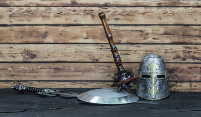 medieval knight's helmet, sword and shield