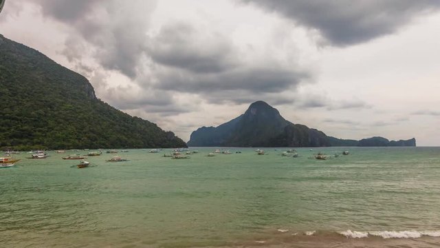 El Nido, Philippines-December 16, 2017. Time lapse of buisy bay with many boats for tourist atractions, private and fishing next to Ferry Terminal on December 16, 2017 at El Nido in Palawan Island 