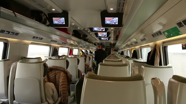 Legs seated passengers protruding into the corridor