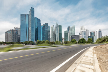 Fototapeta na wymiar empty asphalt highway through modern city