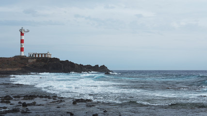 Faro de Punta Rasca or Punta Rasca Lighthouse situated in Palm Mar and reached by a stroll across the volcanic badlands, Tenerife, Canary Islands, Spain