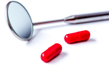 concept tooth pain - dentist tools, tablet at white background