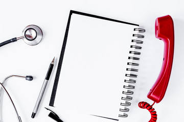 Entry to doctor blank open notebook with stethoscope top view