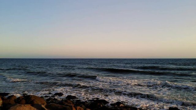 Ocean during sunset. Coast, sky, water, sun
