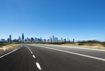 asphalt highway with modern city in chicago