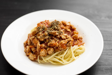 Spaghetti on black wooden background
