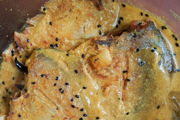 Pomfret fish pieces on a plate.