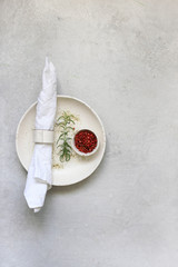 Table setting with spices and fresh herbs