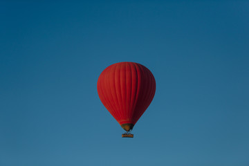 Hot air red balloon in blue sky