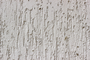 стена покрытая штукатуркой с рельефом царапинами и разводами