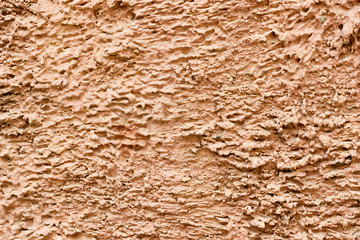 стена покрытая штукатуркой с рельефом царапинами и разводами