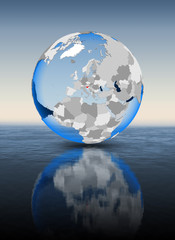 Slovenia on globe in water