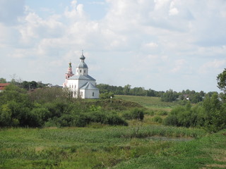 Fototapeta na wymiar Summer landscape with a view of the Orthodox Church, Russia