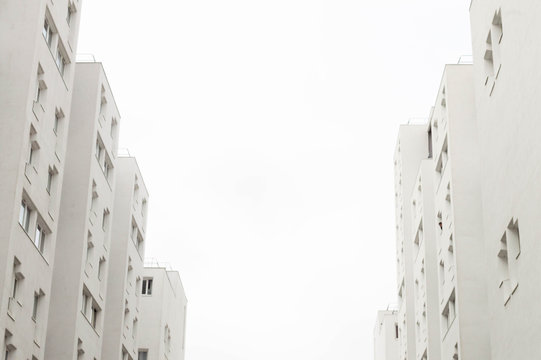 Minimalist architecture. Residential tower with bright light and white color.