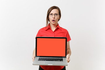 Portrait of business teacher woman in red shirt hold laptop pc computer with blank black empty screen to copy space isolated on white background. Education teaching in high school university concept.