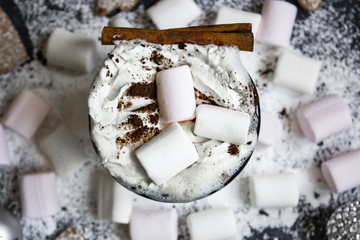Coffee with the cream and the marshmallow around